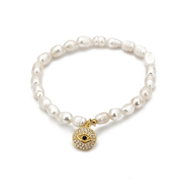 Pearly white evil eye charm bracelet by JeweluxGems
