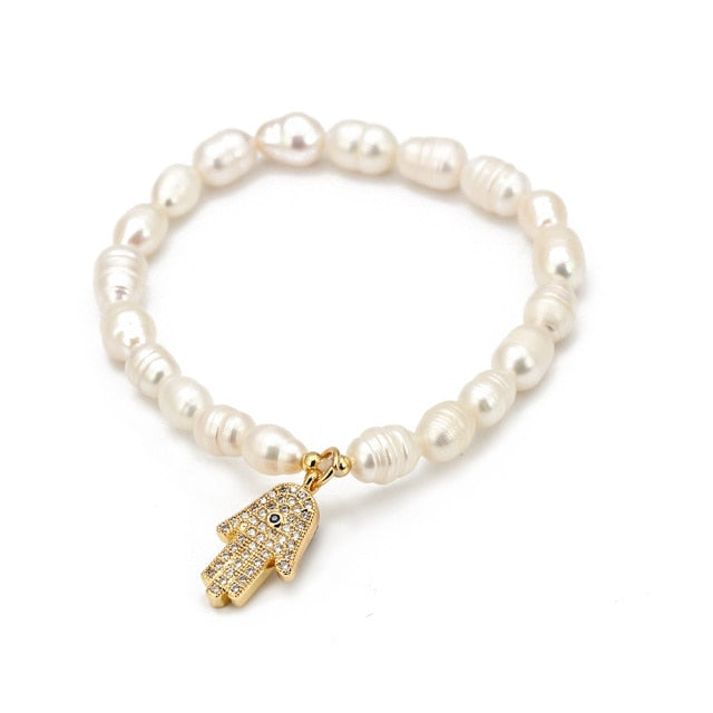 Pearly white evil eye charm bracelet by JeweluxGems